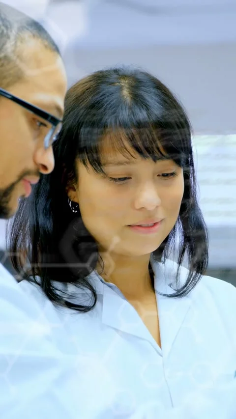 Vertical video: Code overlay appearing woman in lab explaining research, man Stock Footage 335264058