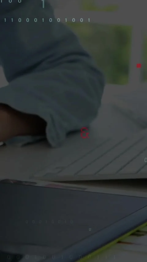 Vertical video: Coder hand tapping stylus on tablet causing C++ code overlays Stock Footage 331238555