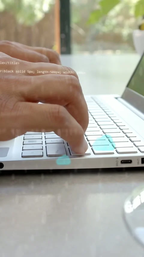 Vertical video: Coder typing keys by window, starting cloud and code hovering Stock Footage 335802564