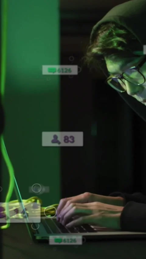 Vertical video: Coder typing on laptop by rack, badges pulsing and counts Stock Footage 330655976