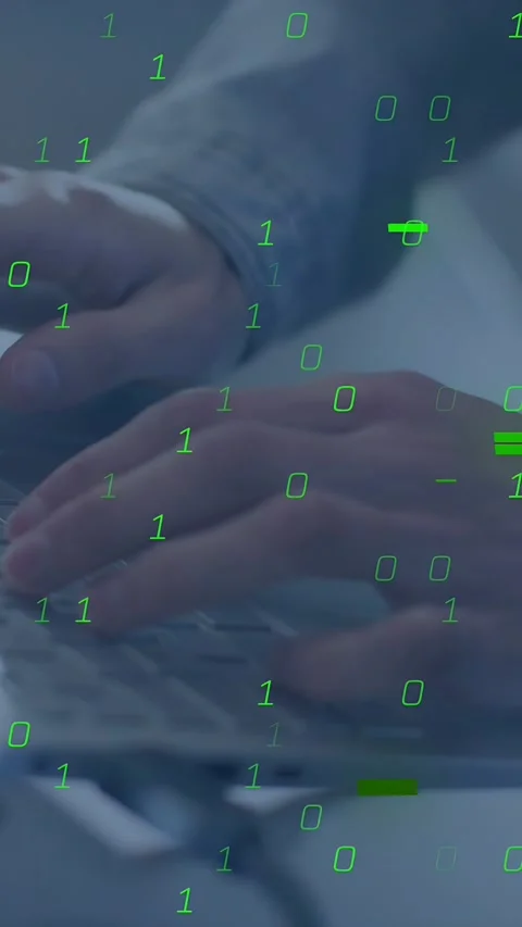 Vertical video: Coder typing laptop keys causing green binary overlay growing Stock Footage 335264188