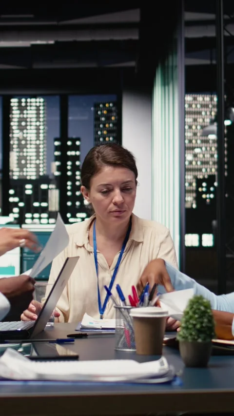 Vertical Video Collaborating, multiethnic team of office clerks completing Stock Footage 334104411