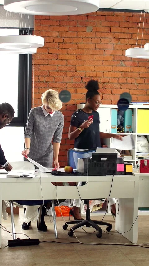 Vertical video of collaborative startup team in modern loft workspace with brick Stock Footage 323417432