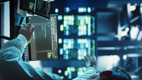 Vertical video Colleagues programming in data center Stock Footage 249968361