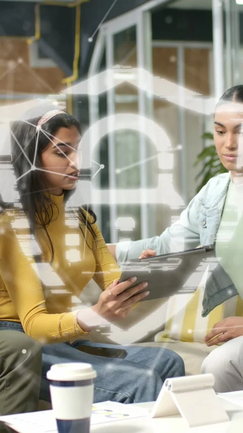 Vertical video: Colleagues receiving tablet checking business data while data Stock Footage 333596458
