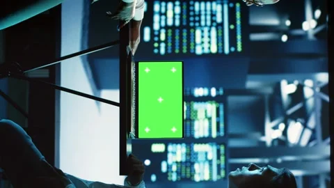 Vertical video Colleagues use chroma key laptop for AI Stock Footage 250361431