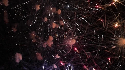 VERTICAL VIDEO, Colorful firework display celebration in the night sky Stock Footage