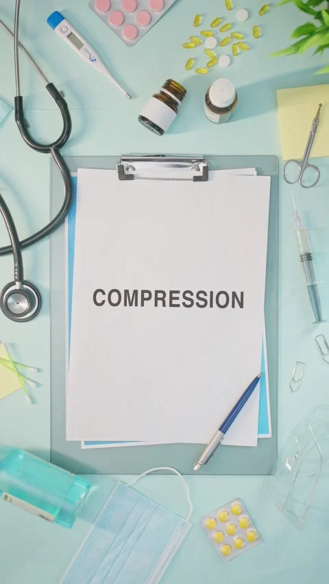 VERTICAL VIDEO OF COMPRESSION WRITTEN ON MEDICAL PAPER 스톡 동영상 308107601