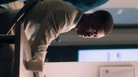 Vertical video Computer operator working nightshift Video stock 246666494