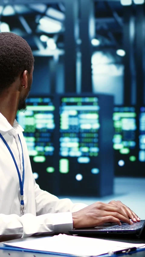 Vertical video Computer scientist fixing server issues Stock Footage 245918721