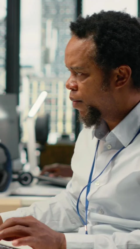Vertical video Computer scientist working in AI startup trains predictive models Stock Footage 323027925