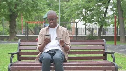 Vertical Video, Concerned African Man Upset after Online Banking Failure Stock Footage 310833560
