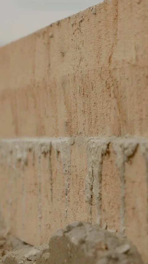 Vertical video Concrete drying process in house construction using wooden Stock Footage 327604001