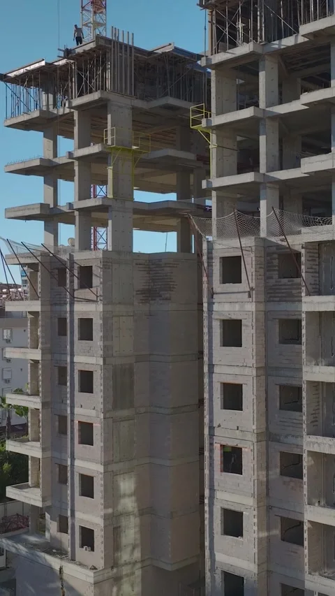 Vertical Video Concrete High Rise Structure with Repetitive Floor Pattern and Stock Footage 342453621