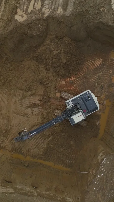 Vertical Video of Construction Machinery Preparing Ground for Structure Support Video stock 342408986