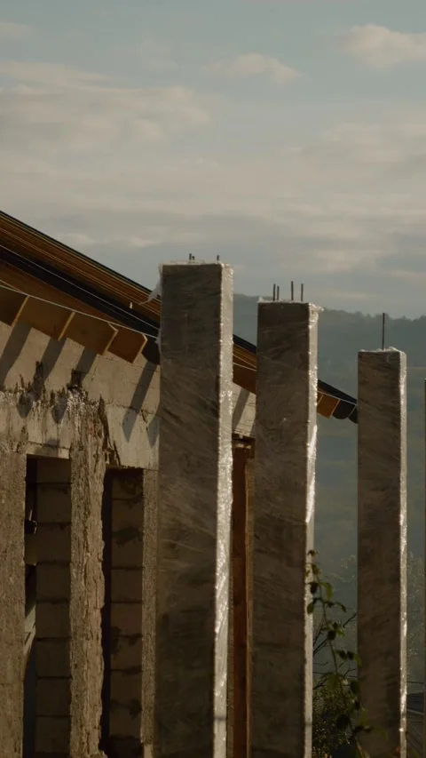 Vertical video Construction progress of house with roof installation and Stock Footage 327601275