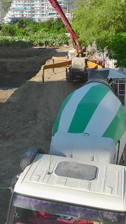 Vertical Video: Construction Site Activity With Workers and Heavy Equipment Stock Footage 344279156
