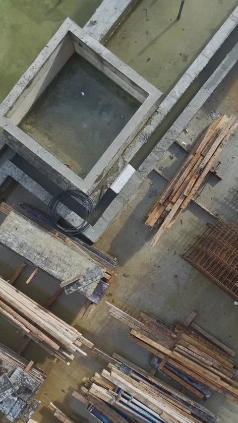 Vertical Video: Construction Site Background With Workers Performing Various Stock Footage 342572248