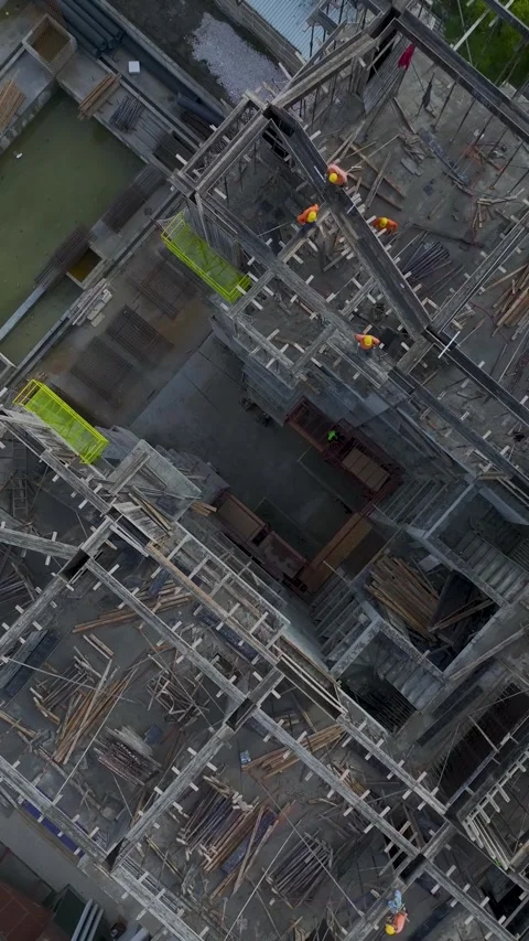 Vertical Video: Construction Site Background With Workers Operating Machinery Stock Footage 342573882