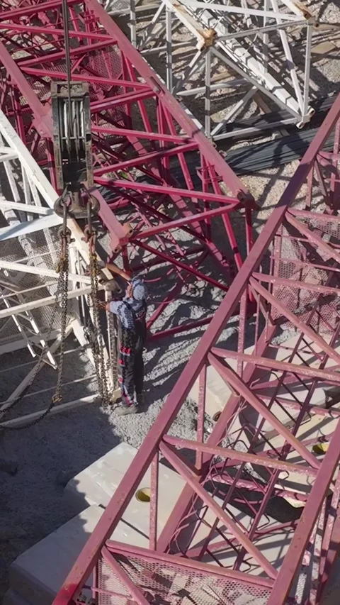 Vertical Video: Construction Site Captured From Above Featuring Skilled Workers Stock-Footage 297700370