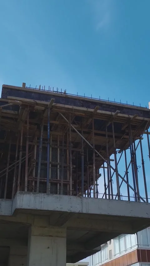 Vertical Video: Construction Teams Actively Working With Tools, Metal Framework Stock Footage 342909713