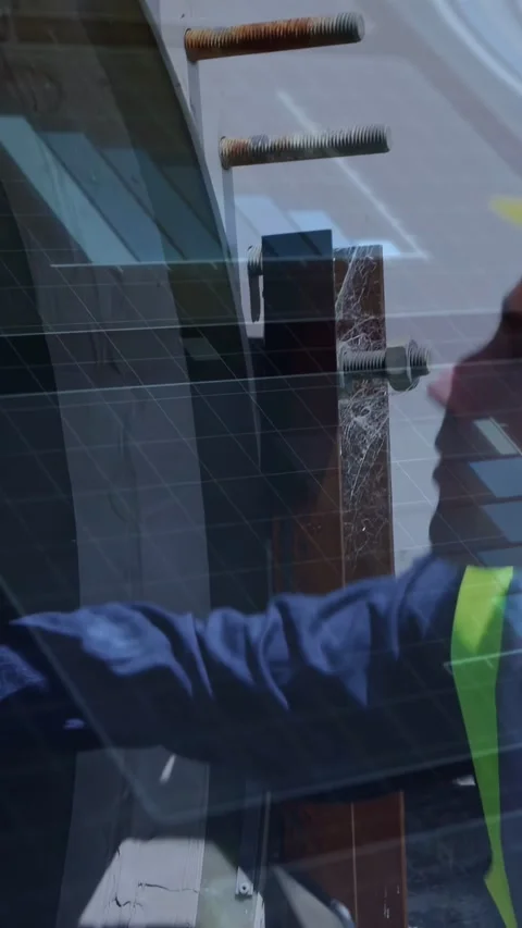 Vertical video: Construction tech using phone or tablet checking bolts showing Stock Footage 332846160