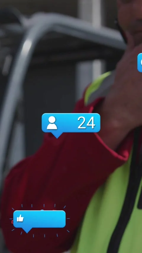 Vertical video: Construction worker tapping tablet animating social bubbles and Stock Footage 333835971