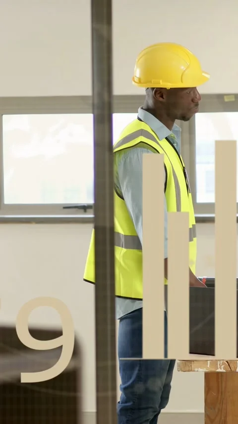 Vertical video: Construction worker using laptop, monitoring data with scrolling Stock Footage 334792760