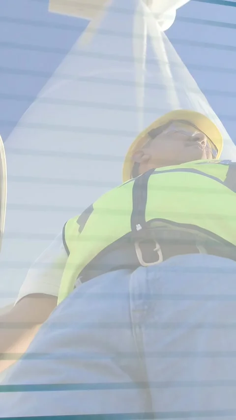 Vertical video: Construction worker walking over low camera, checking harness Stock Footage 333036954