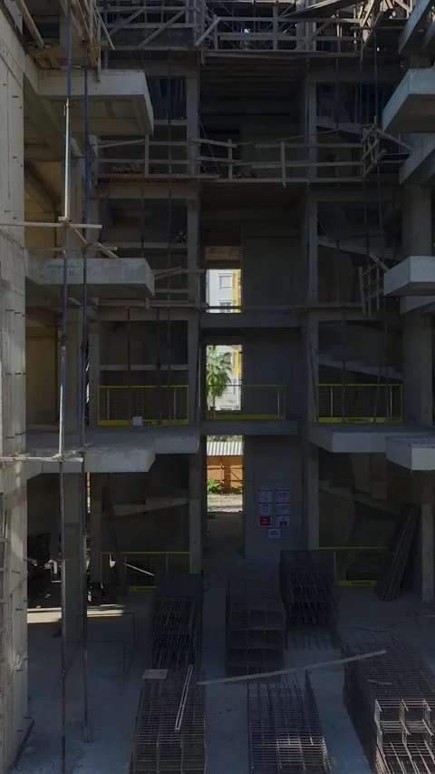 Vertical Video: Construction Workers Handling Tower Crane Parts With Precision Stock Footage 297708114