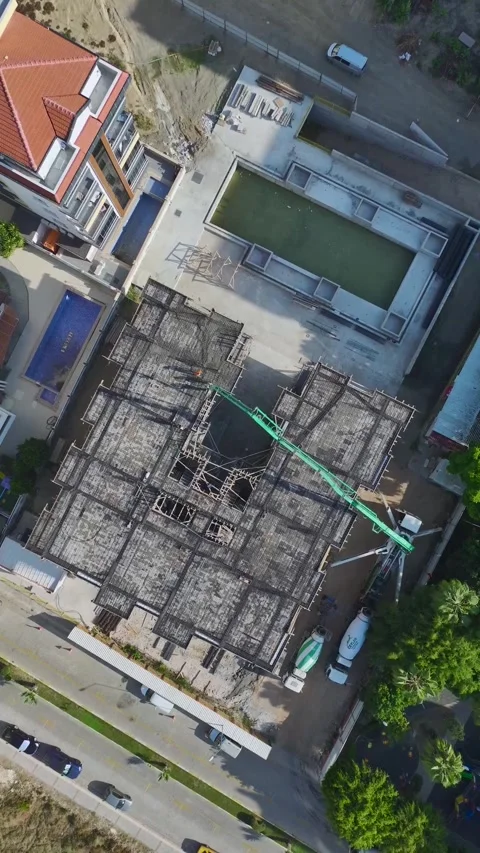 Vertical Video: Construction Workers Pouring Concrete and Performing Various Stock-Footage 297788263