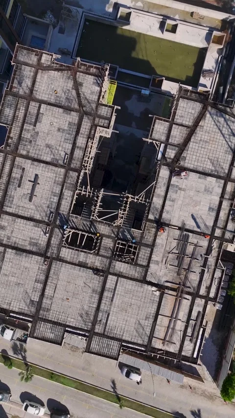 Vertical Video: Construction Workers Preparing Materials and Using Tools on a Stock Footage 342577701