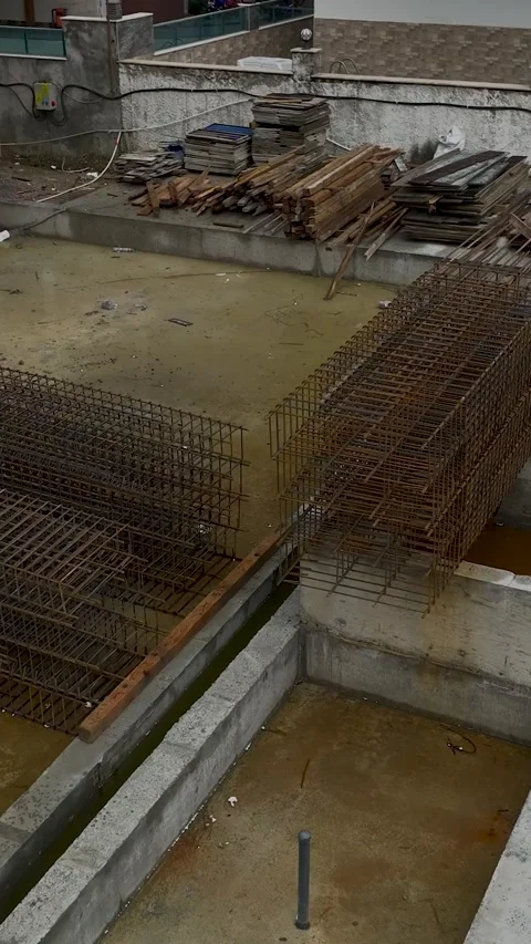 Vertical Video of Construction Workers Tightening Wall Supports Stock Footage 342412810