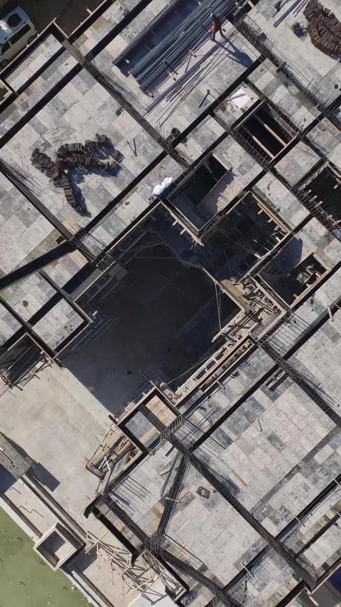 Vertical Video: Construction Worksite Featuring Stone Cutting, Facade Work, and Stock Footage 297750769