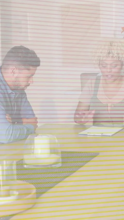 Vertical video: Consultant pointing at notebook and initiating notes in business 動画素材 333978227
