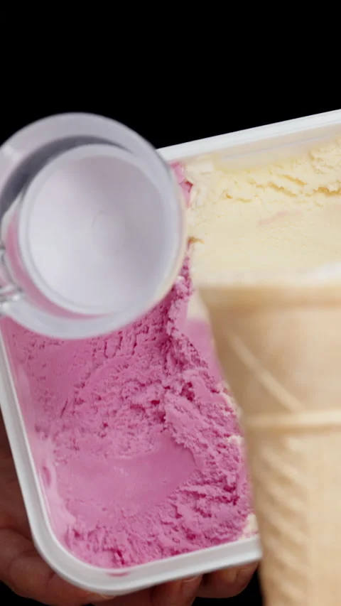 A scoop of pink ice cream in a specializ, Stock Video