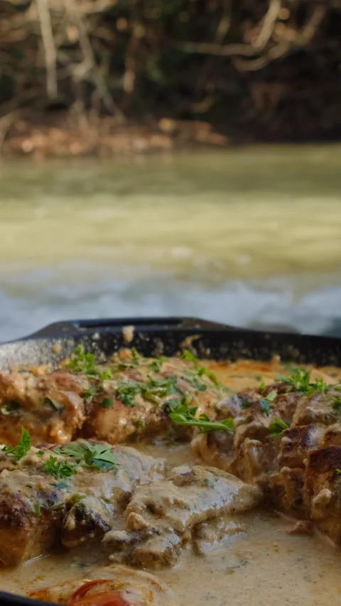 Vertical video of cook baked chicken with tomatoes and cheese sauce in pan Stock Footage 303959190