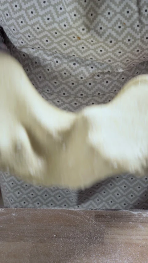 Vertical video. The cook is kneading the curd cookie dough in his hands. Stock Footage 309301647