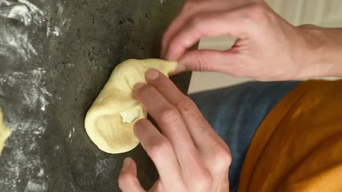 Vertical video. The cook prepares cheese filled bread rolls. Stock Footage 311046059