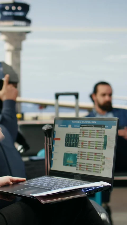Vertical Video Corporate executive checking reports and analytics on laptop in Stock Footage 339665624
