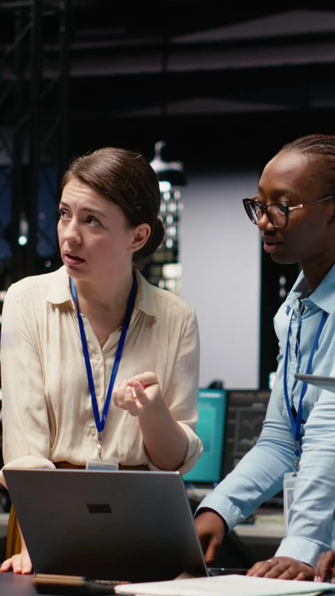 Vertical Video Corporate team gathered around office desk collaborating on Stock Footage 334104732