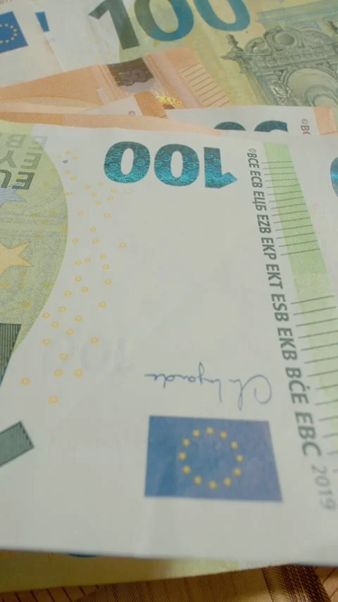 Vertical video Counting Euro banknotes in macro detail with close-up inspection Stock Footage 327596898