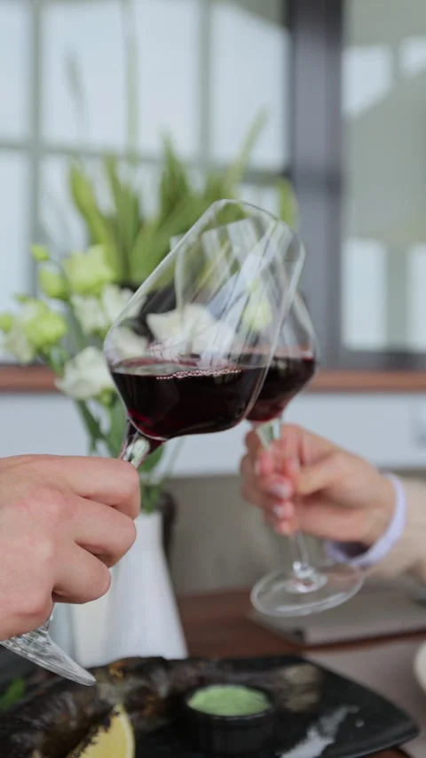Vertical Video Couple clinking glasses of wine in restaurant. Stock Footage 319015665