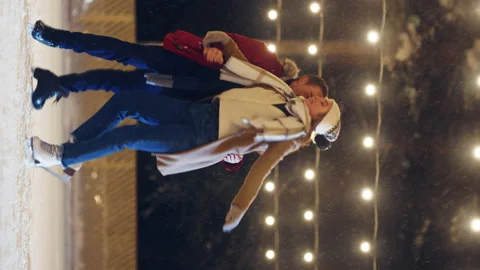 Vertical Video Couple Ice Skating Stock Footage 169144682