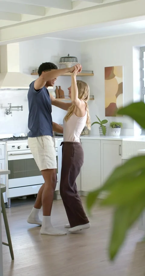 Vertical video: Couple starting dance with man taking woman's hand, leading in Stock Footage 345323384