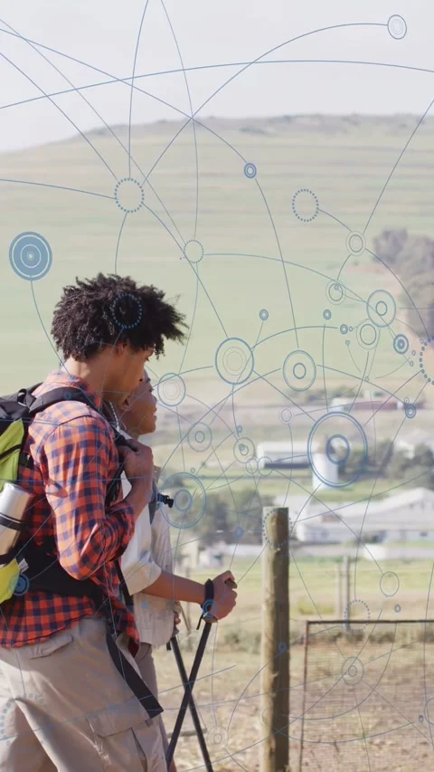 Vertical video: Couple walking as pullback showing blue nodes linking them and Video stock 333236465