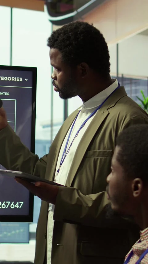 Vertical Video Coworkers engaging in a problem solving meeting at a corporation Stock Footage 319468111