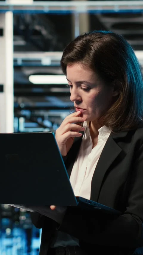 Vertical video Creating digital twin scan, laptop and admin in data center Stock Footage 329317543