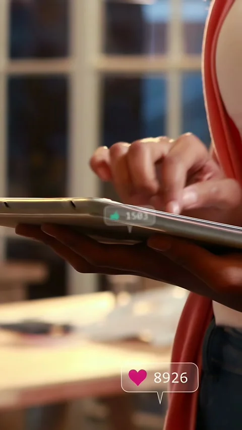 Vertical video: Creator tapping tablet, making social media hearts and fans 스톡 동영상 335264234
