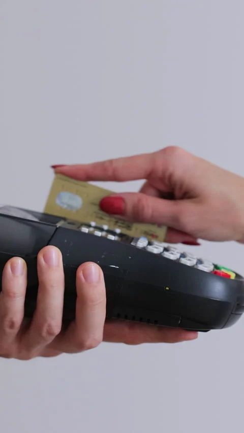 Vertical video. Credit card machine for money transaction. Stock Footage 345703375
